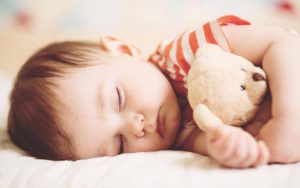 How should I choose a mattress for babies?